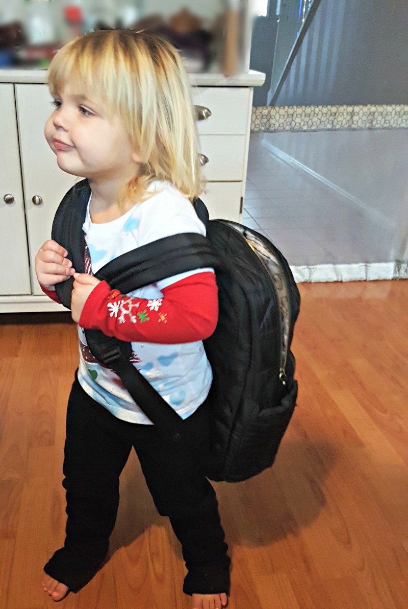 Holding backpack from TWELVElittle