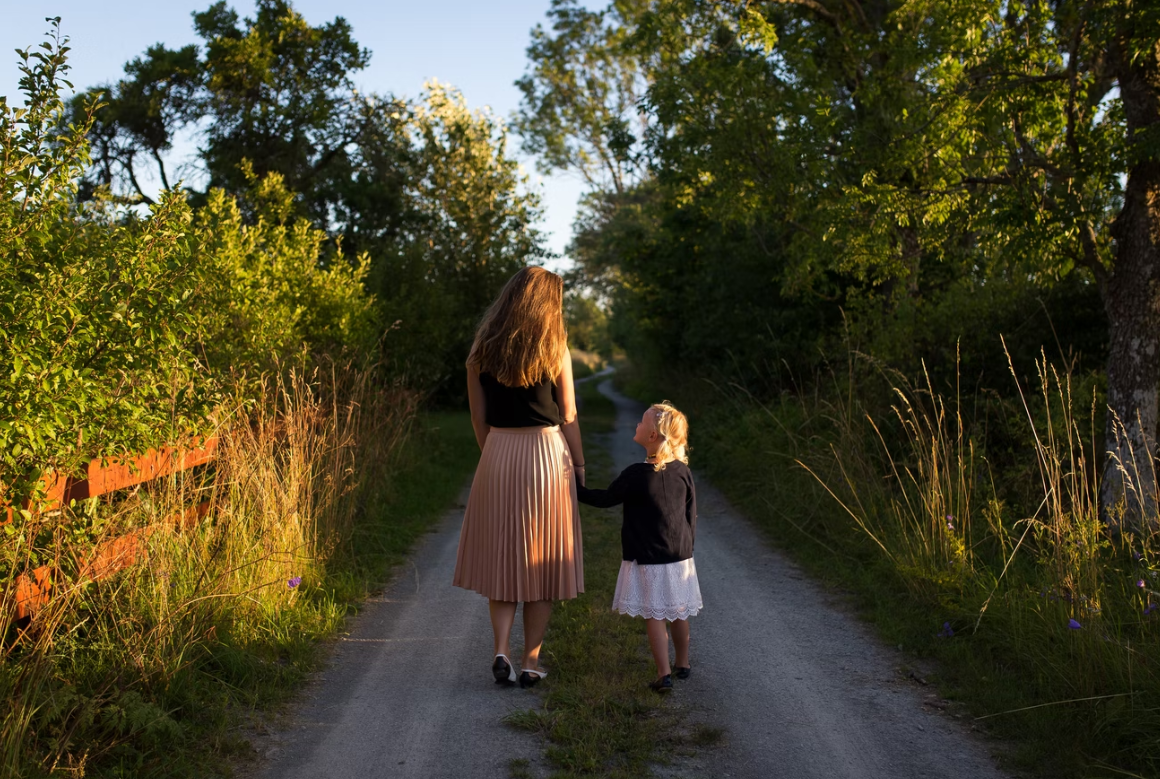 mom walking with child