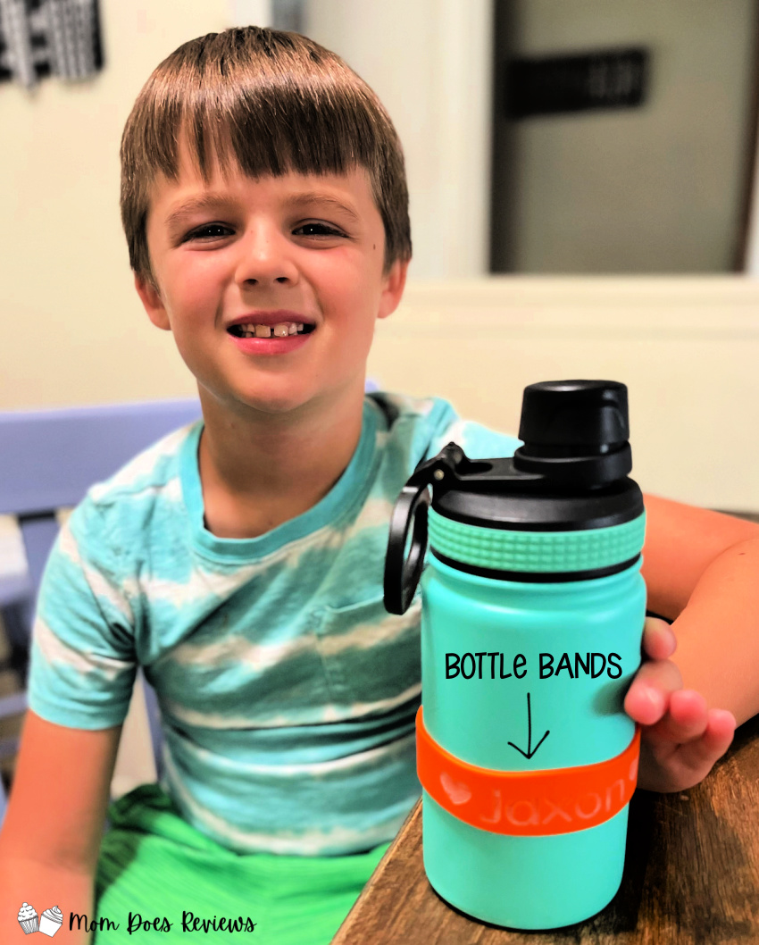 child showing off bottle band back-to-school