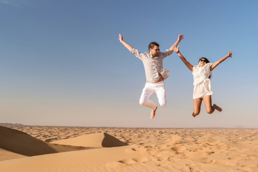 Dubai Desert couple jumping