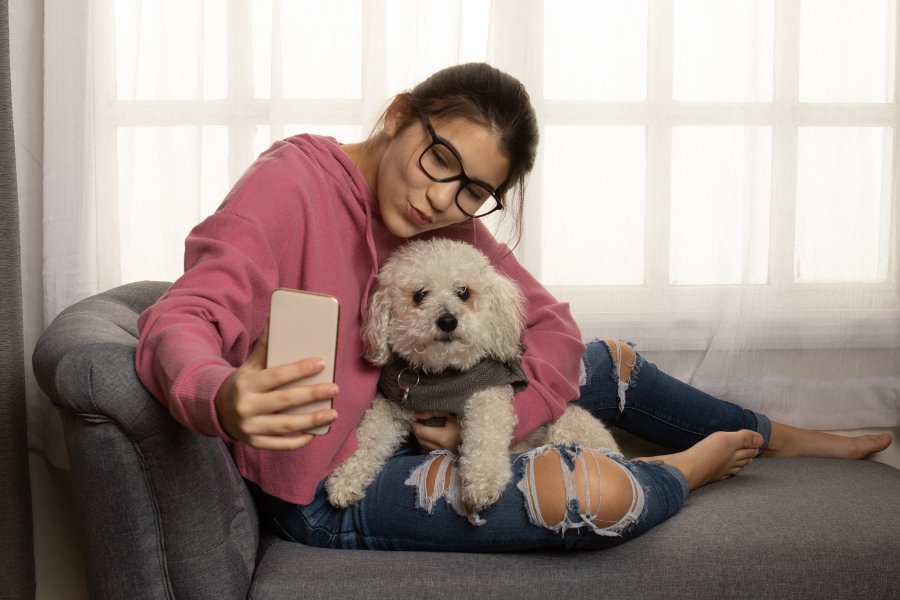 dog and woman taking selfie