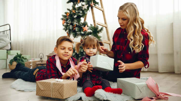 gift for kids with mom under Christmas tree