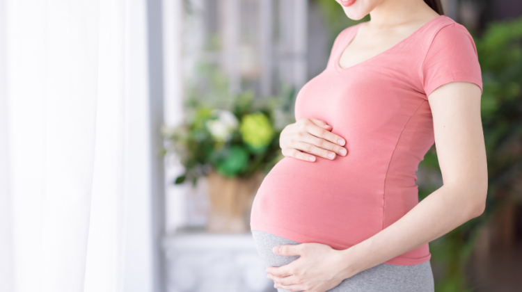 pregnant belly pink shirt