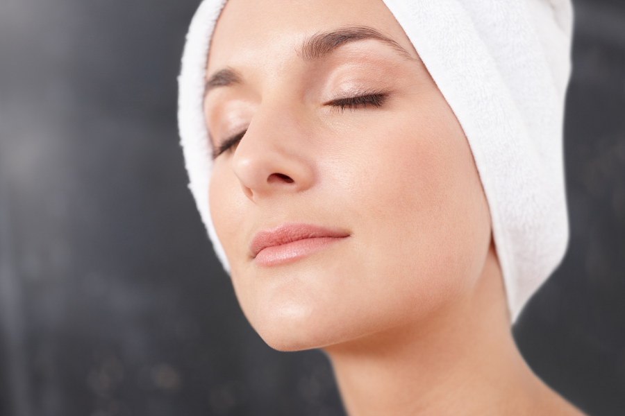 woman relaxed with towel on head