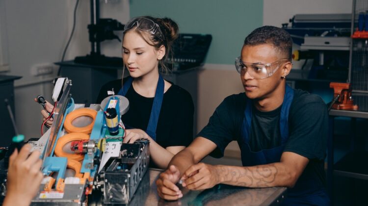 man and woman working in factory