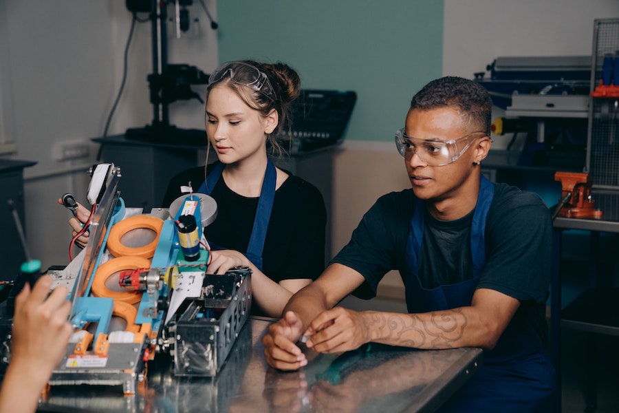 man and woman working in factory