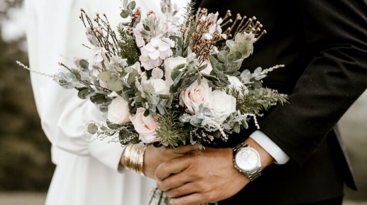 bride and groom holding bouquet