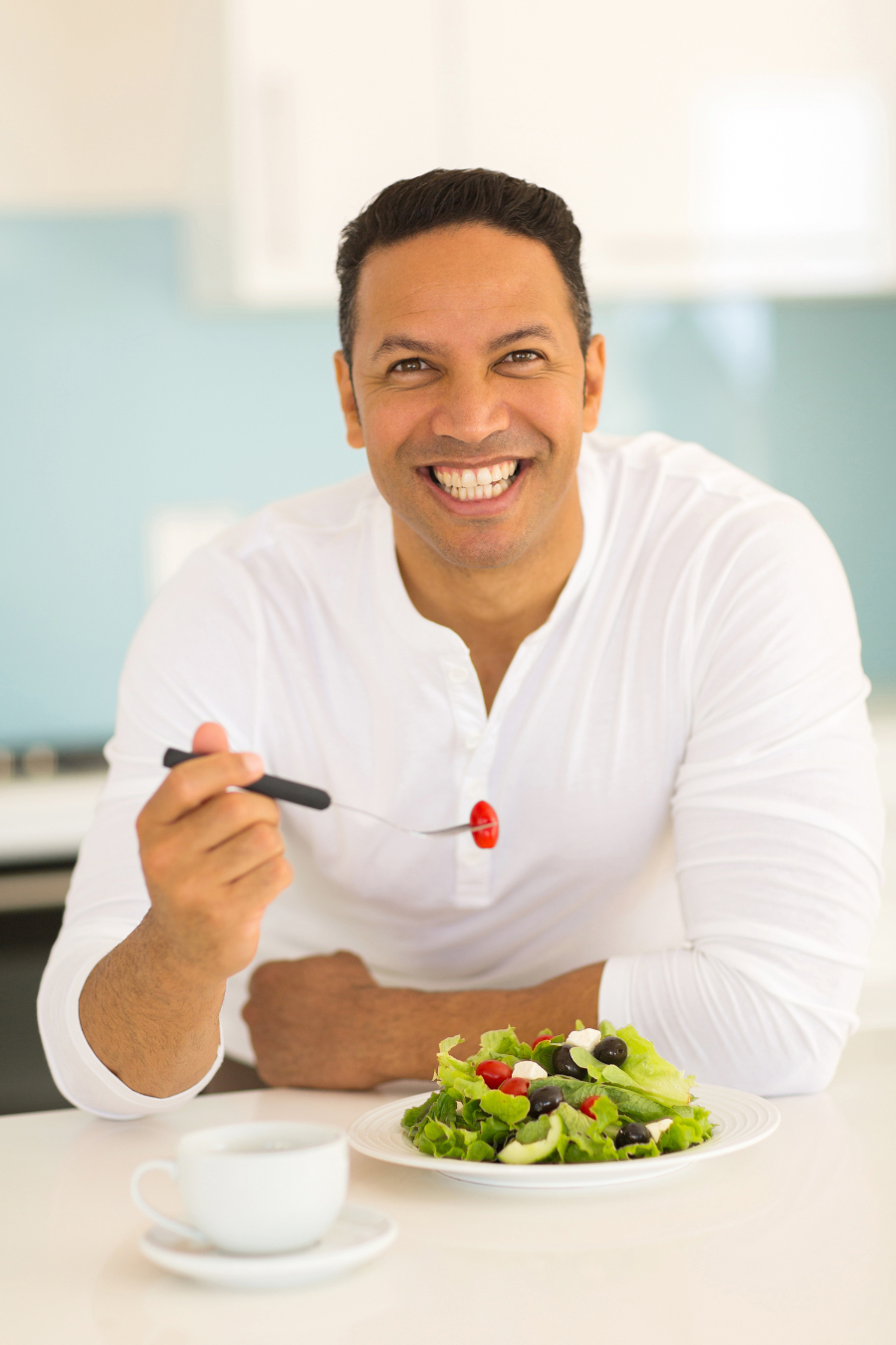 man eating a salad