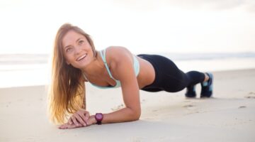 woman exercising on beach