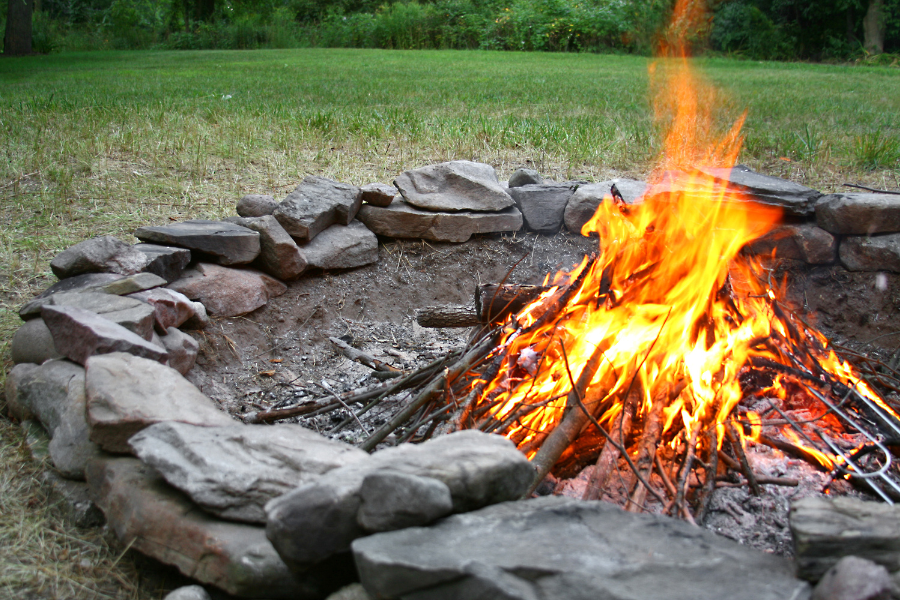 stone firepit on lawn