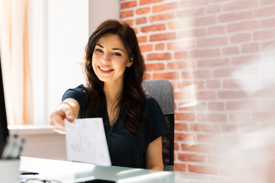woman holding paystub