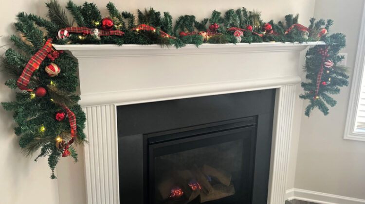 quntis garland on fireplace