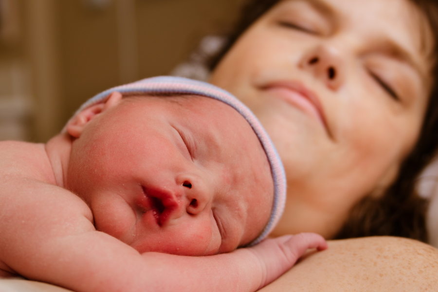newborn baby on mom