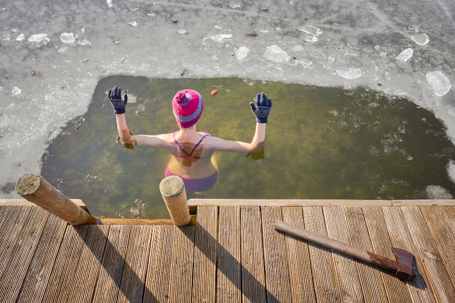 lady in ice water in lake