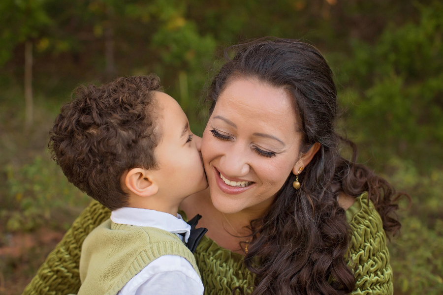 son kissing mom on cheek