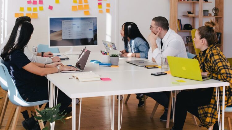 A team in an office discussing CTI during a meeting