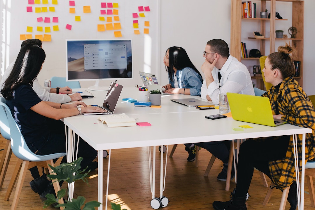 A team in an office discussing CTI during a meeting