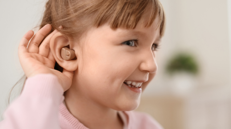 girl with hearing aids