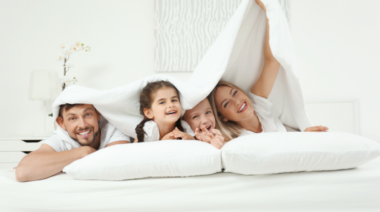 happy family under a blanket
