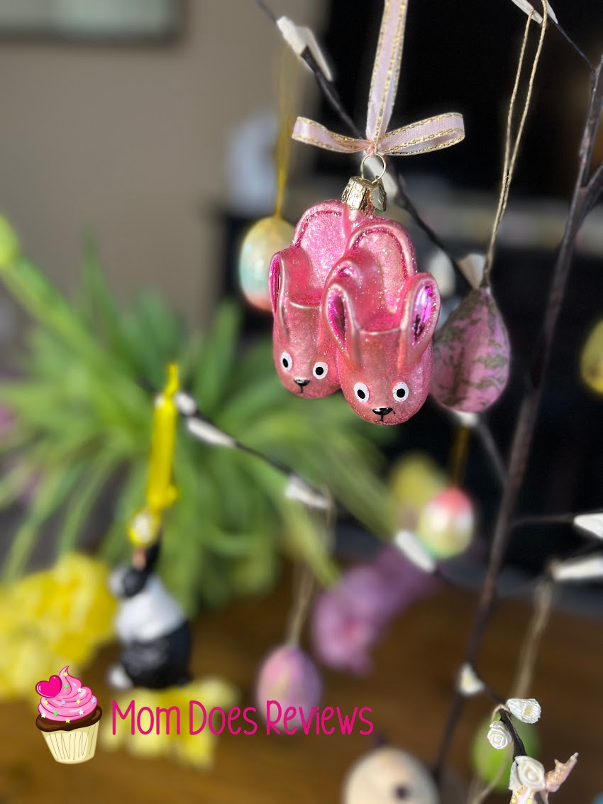 Old World Christmas Pink bunny slippers ornament in a tree