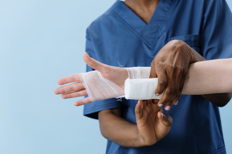 hand being bandaged