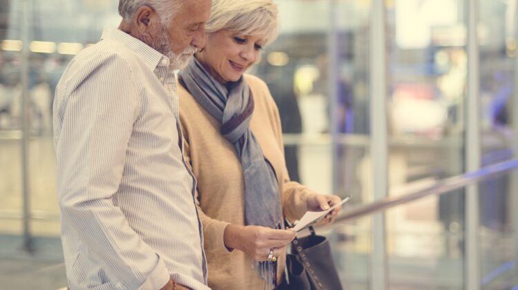 Senior couple traveling airport scene
