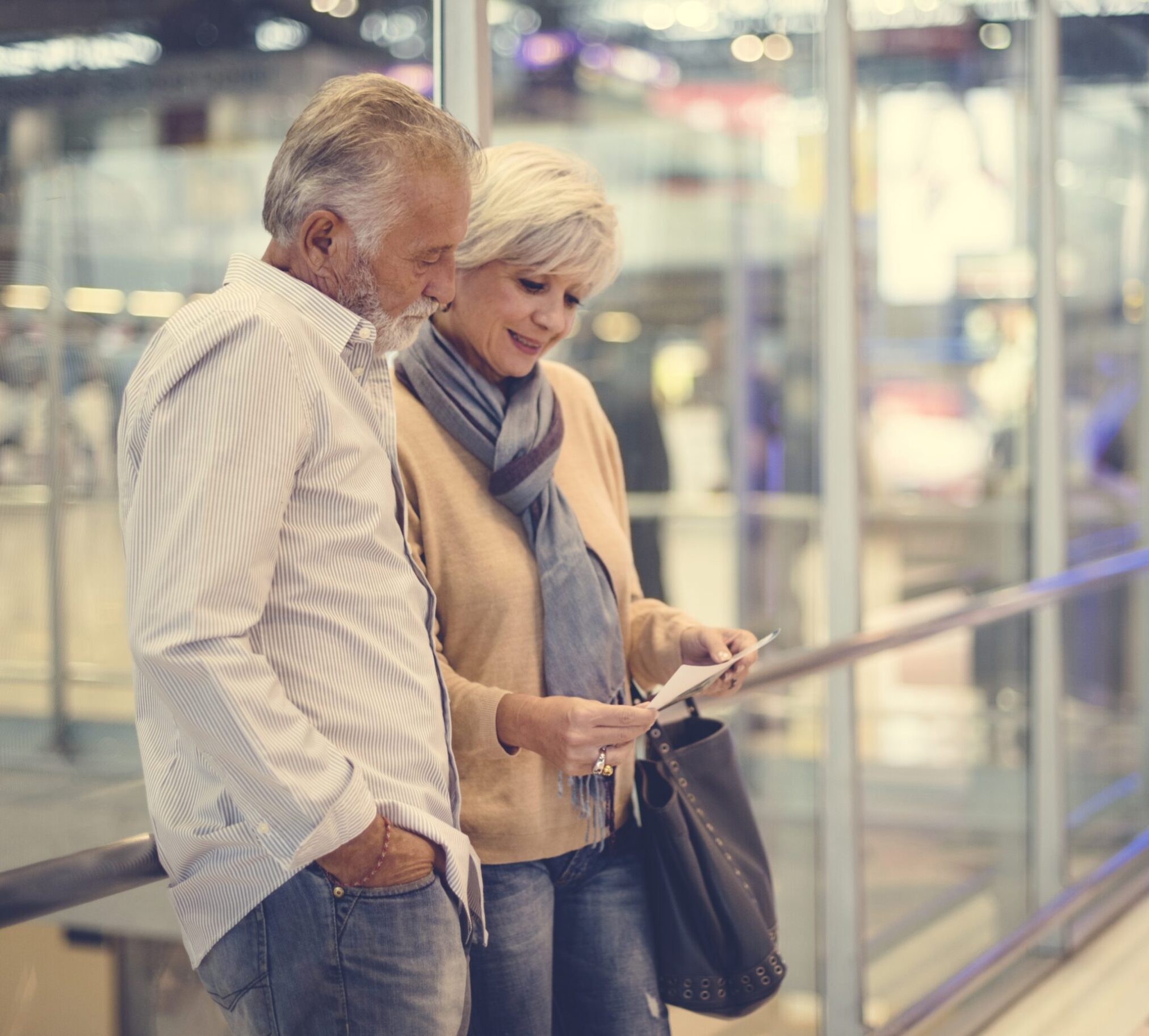 Senior couple traveling airport scene