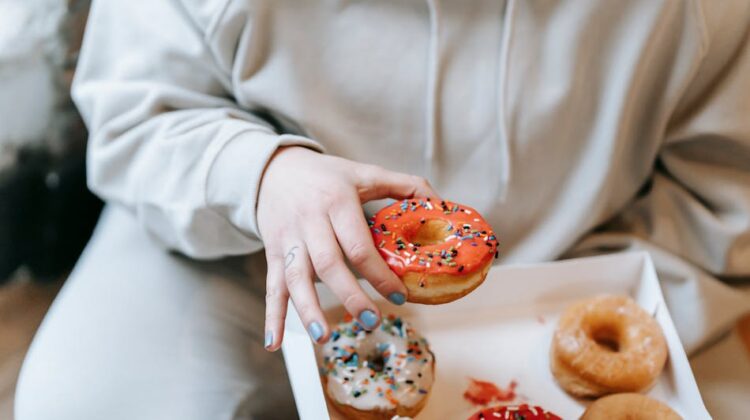 woman holding donut