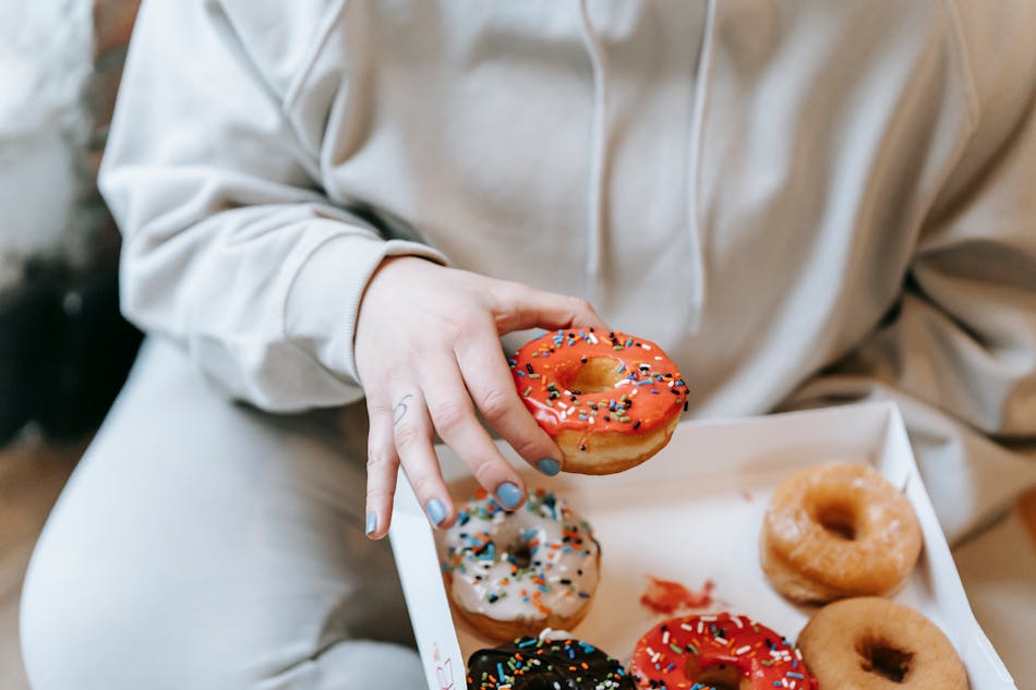 woman holding donut