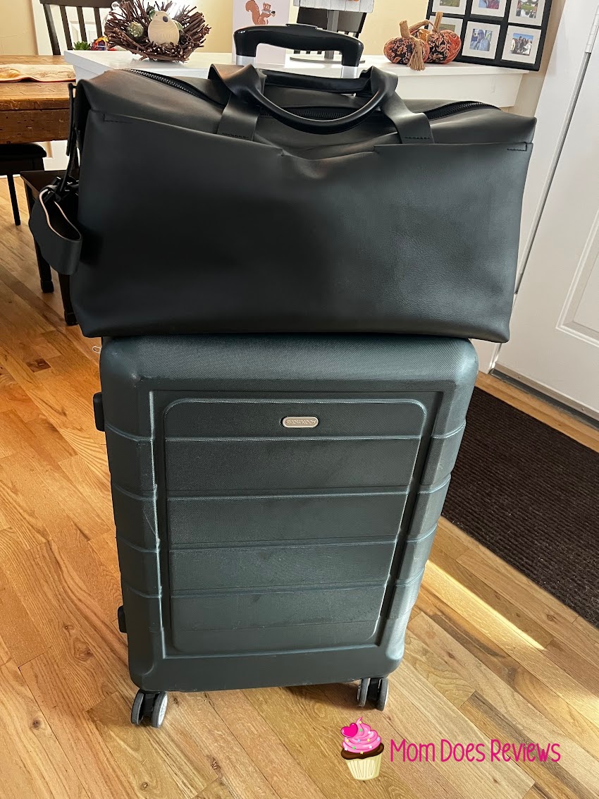 Troubadour duffle on top of suitcase