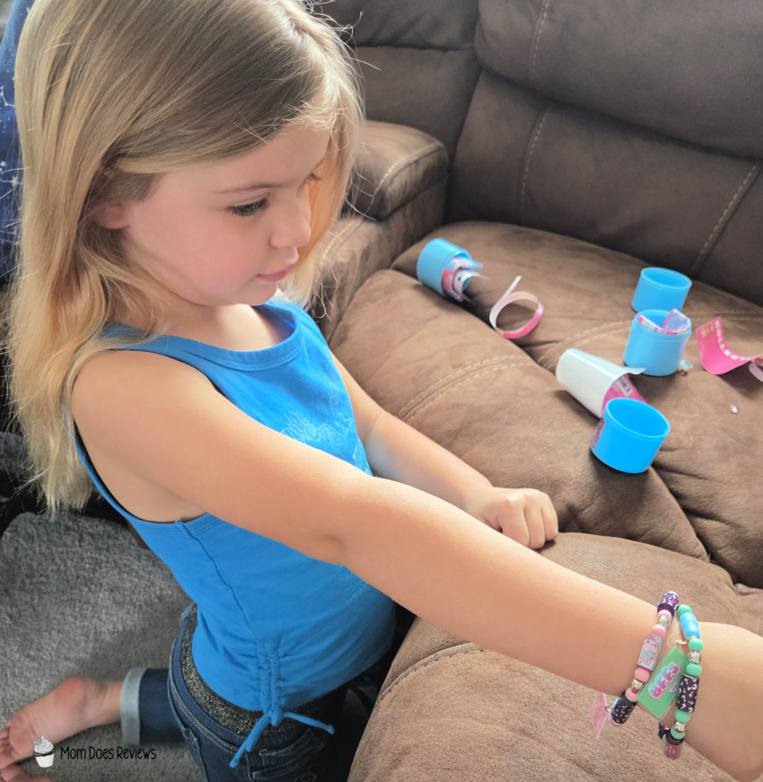 Little Girl Paying With Sticki Rolls
