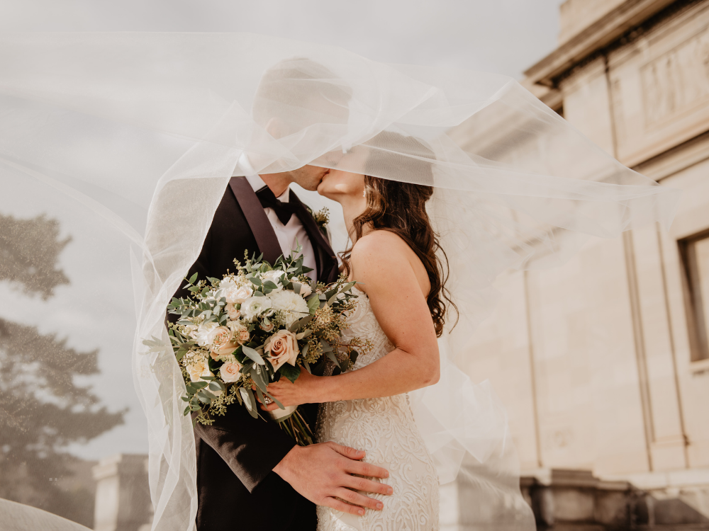 bride and groom with veil