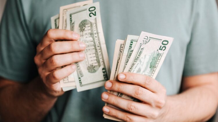 man counting money