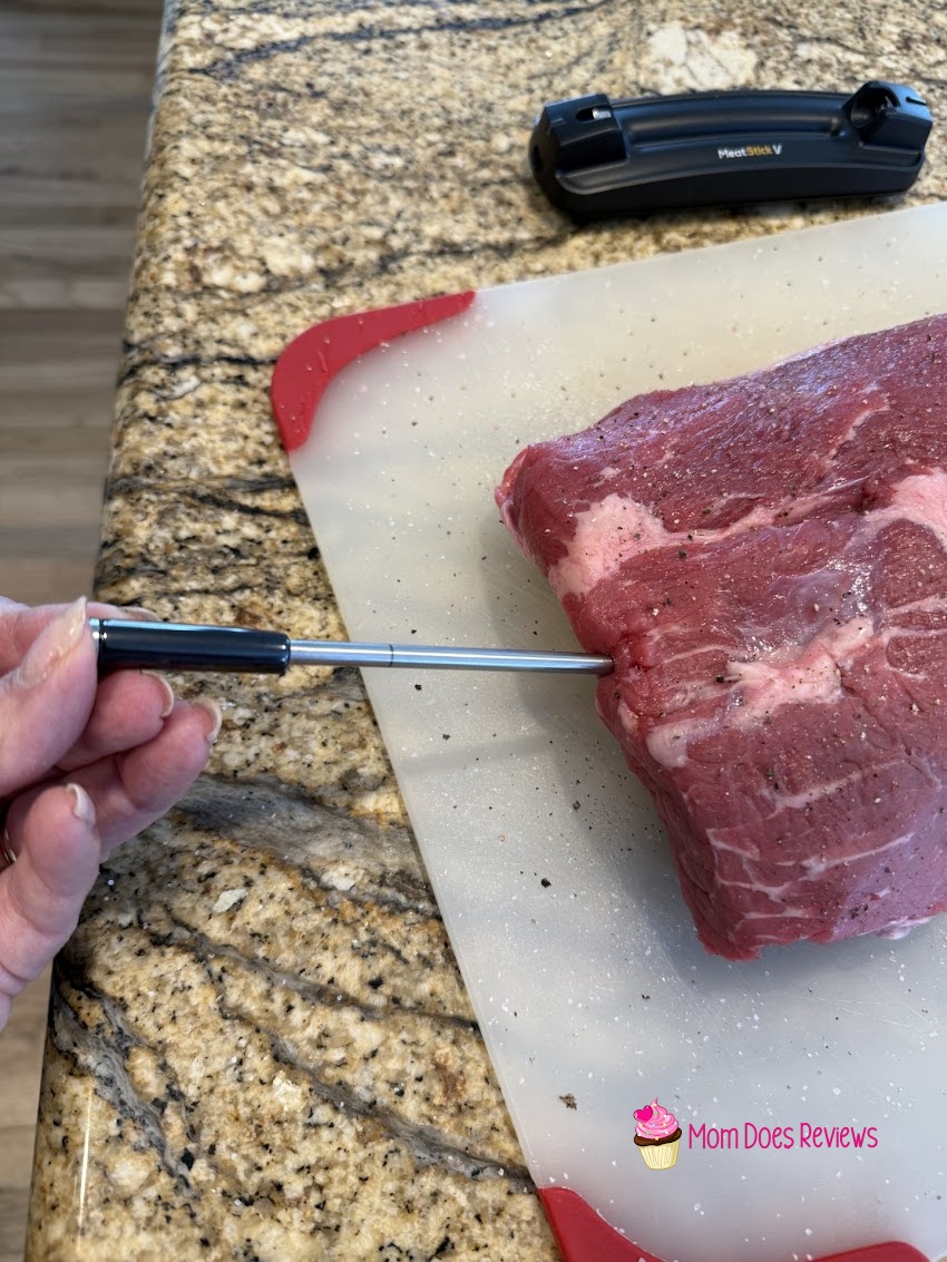 MeatStick V being inserted into a raw roast