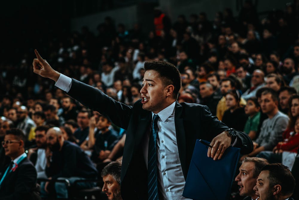 Dynamic coach at a basketball game.