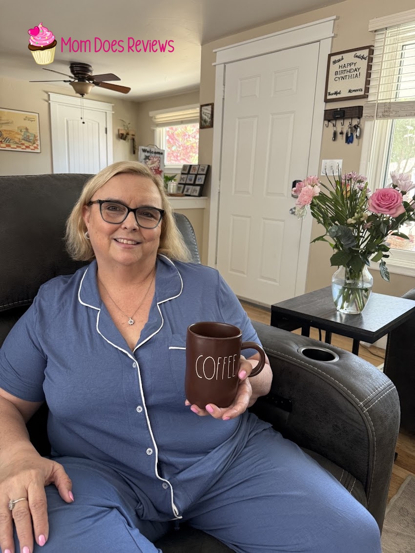Woman on couch with coffee wearing Piper & Mint pajamas