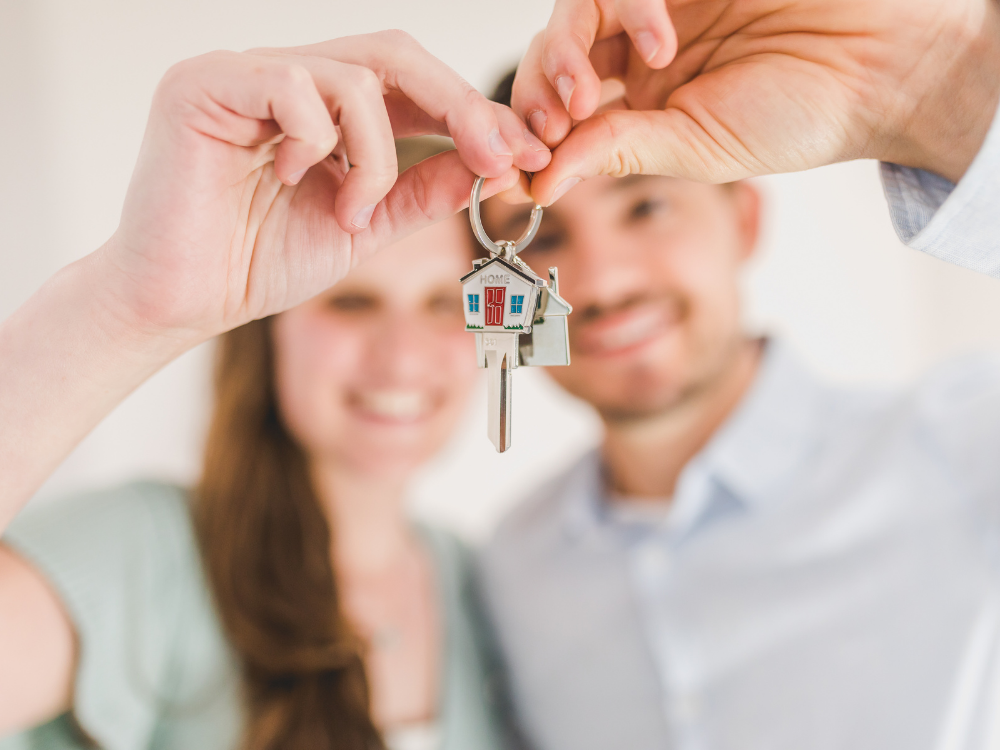 couple holding house keys