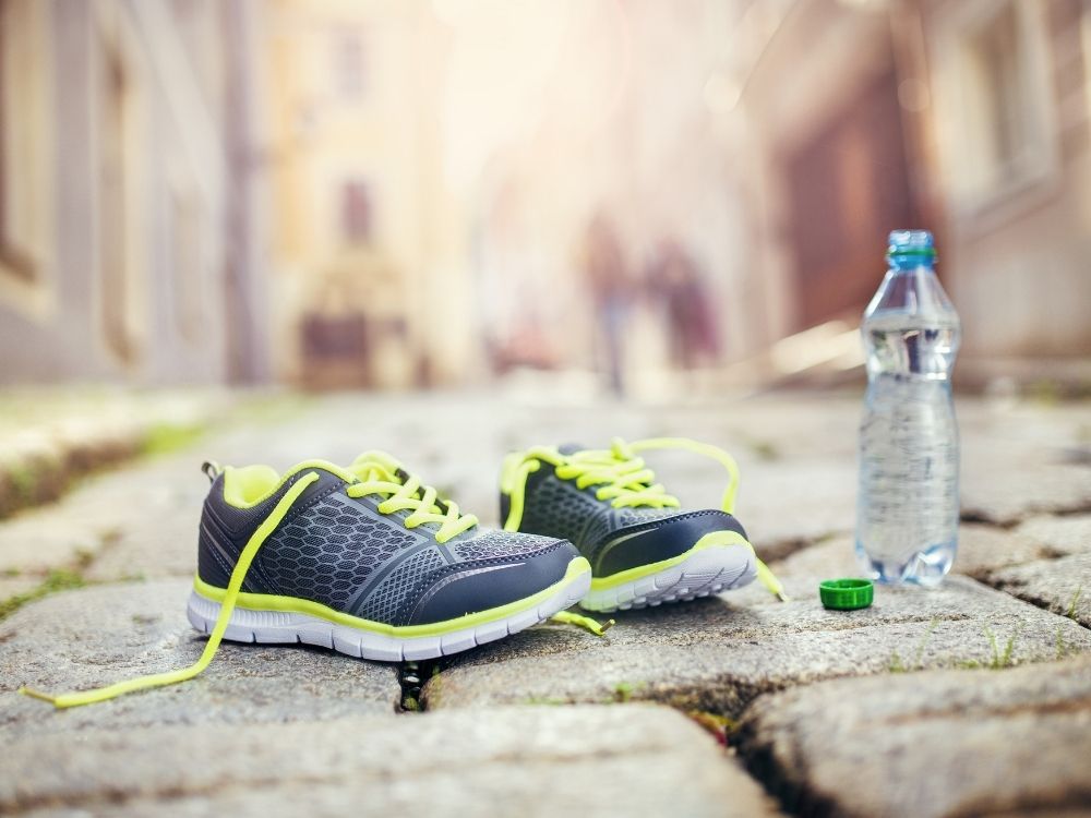 water bottle and running shoes