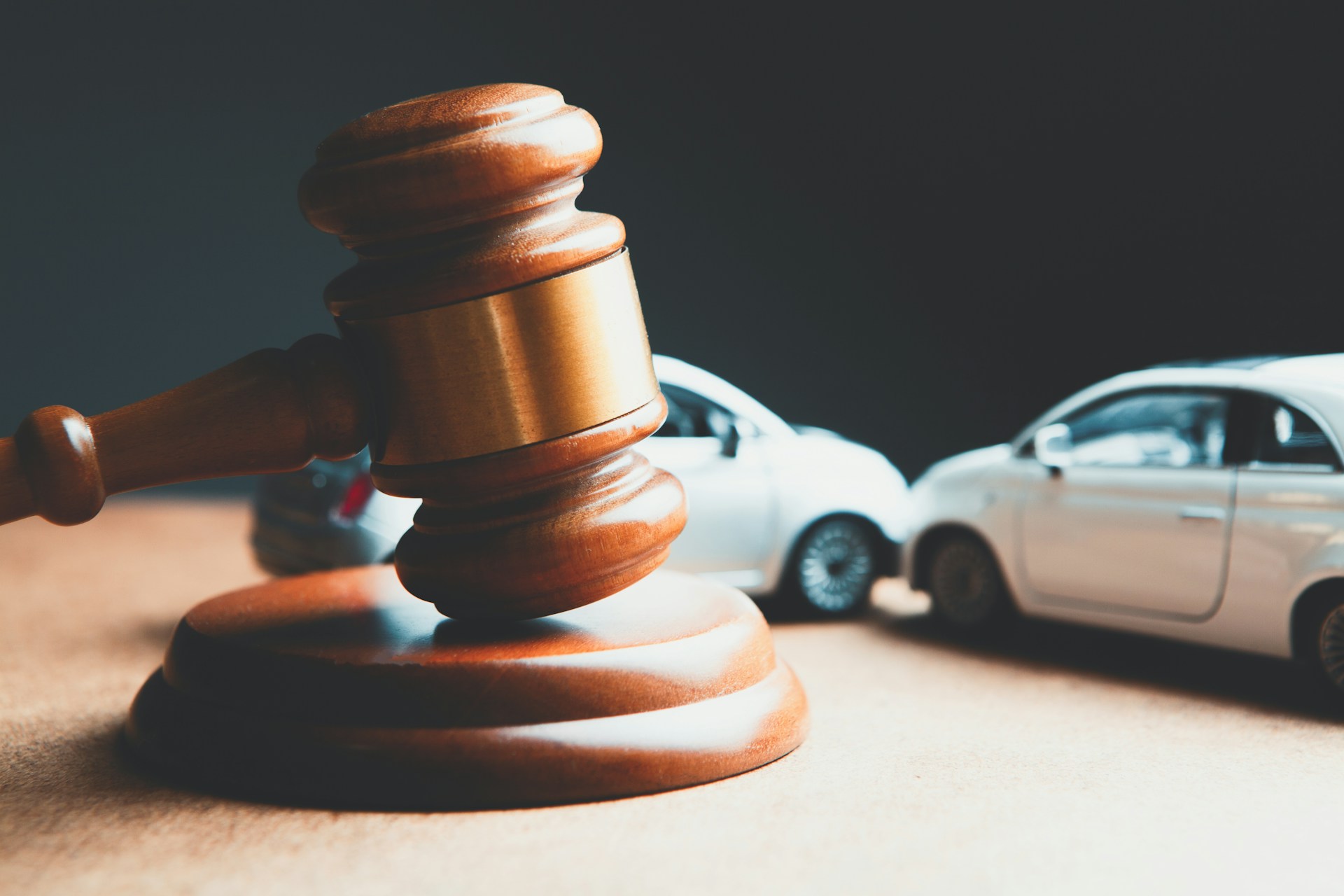 Toy car and wooden gavel