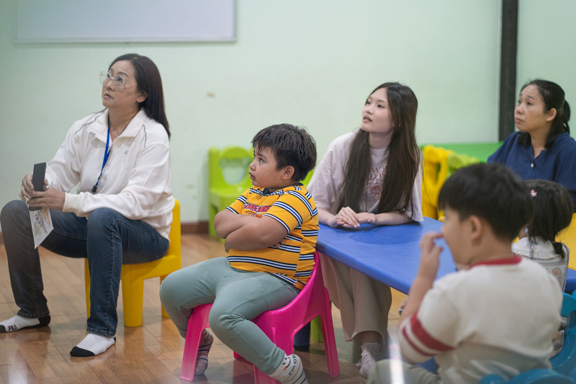 adults and kids in therapy setting