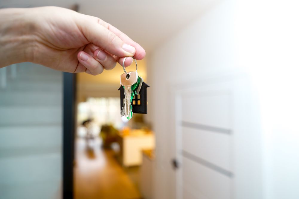 holding home keys