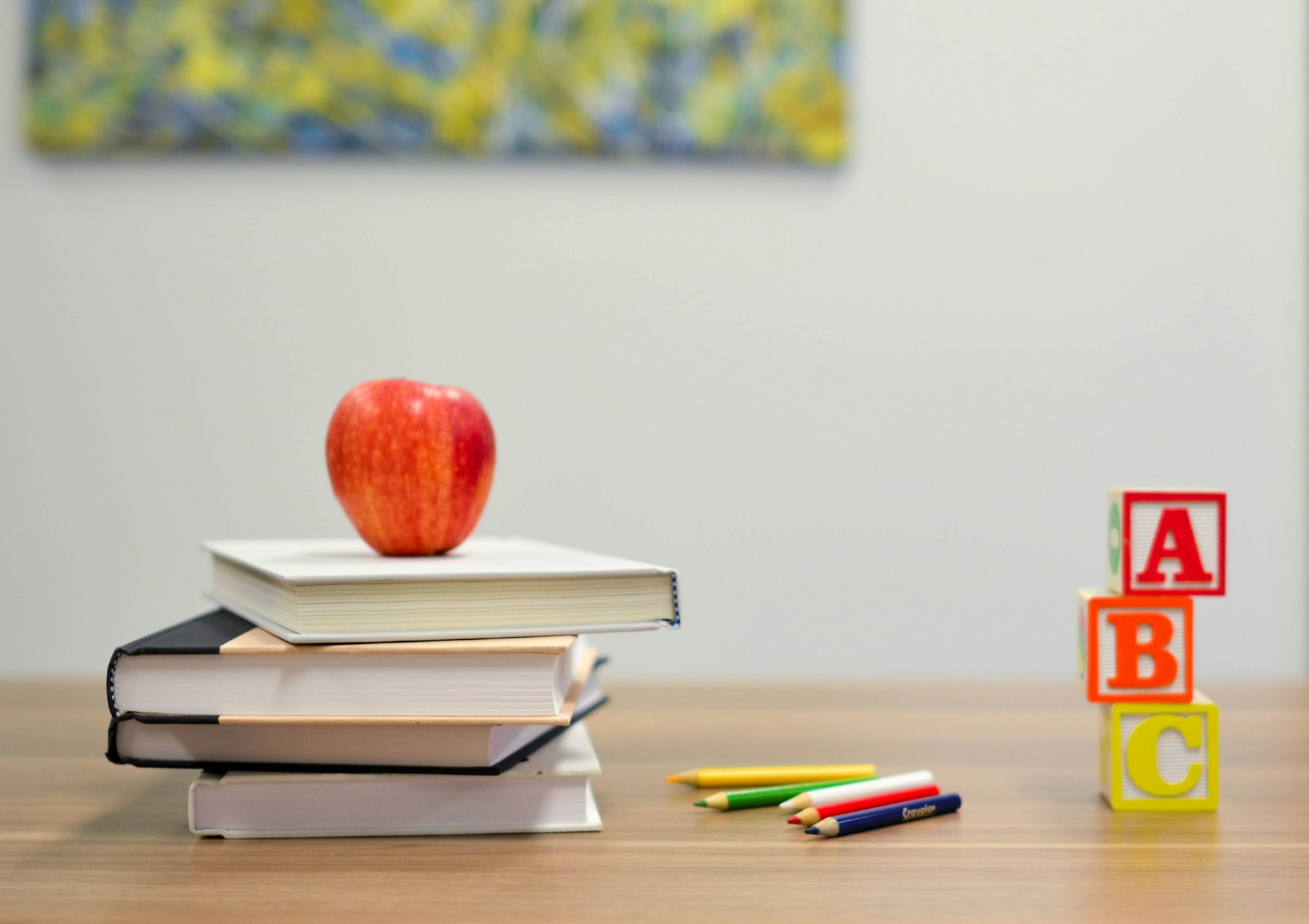 red apple and books