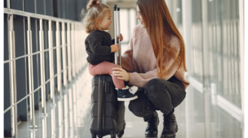 toddler on suitcase