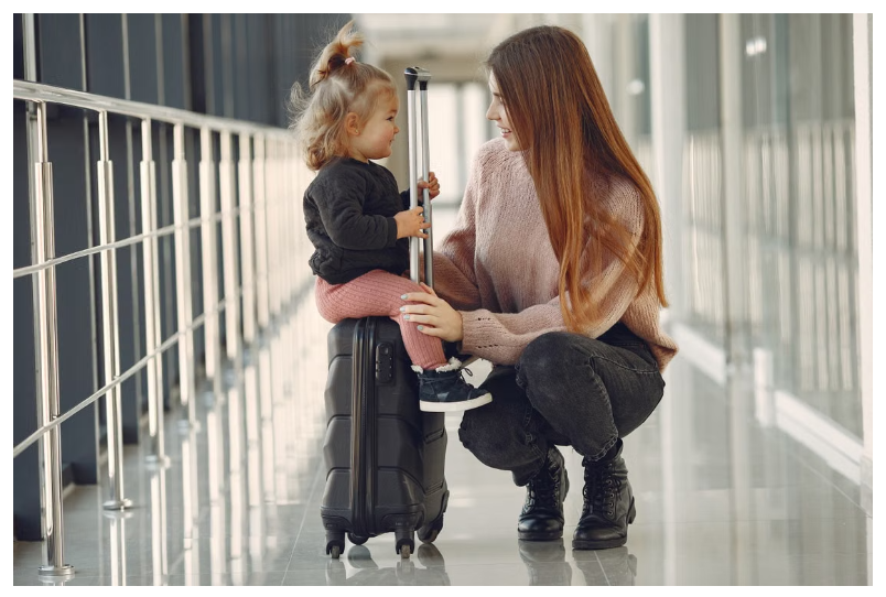 toddler on suitcase