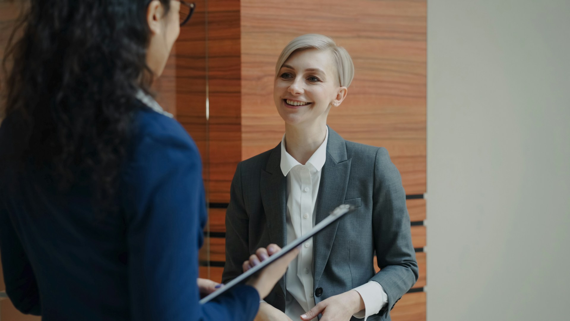 two women in suits