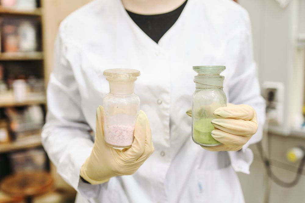 white lab coat holding stuff