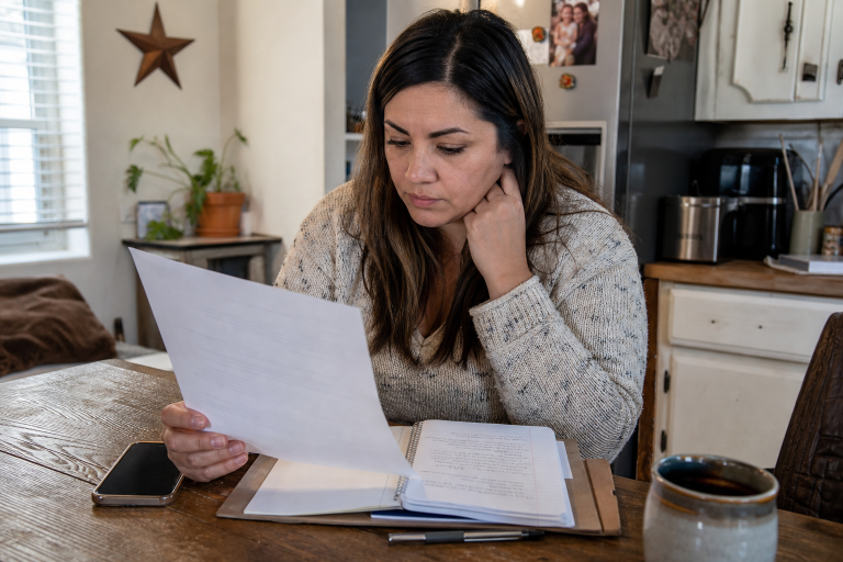 woman looking at paperwork