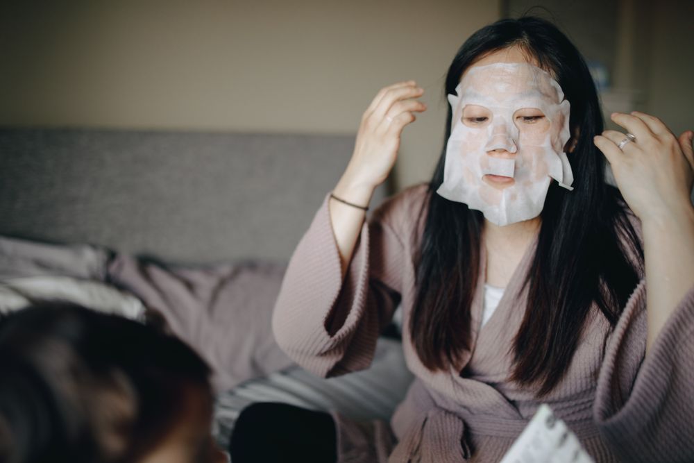 woman with face mask self care
