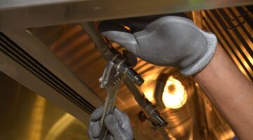 close up of man using a wrench
