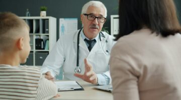 doctor consults with mom and child